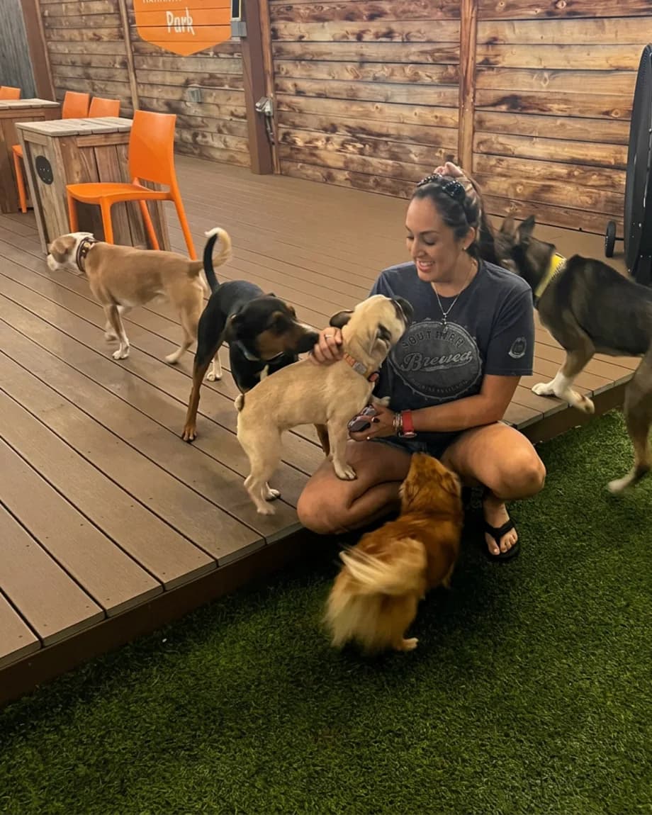 April surrounded by dogs